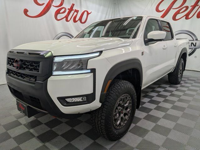 2026 Nissan Frontier PRO-4X R in Glacier White — front three-quarter view