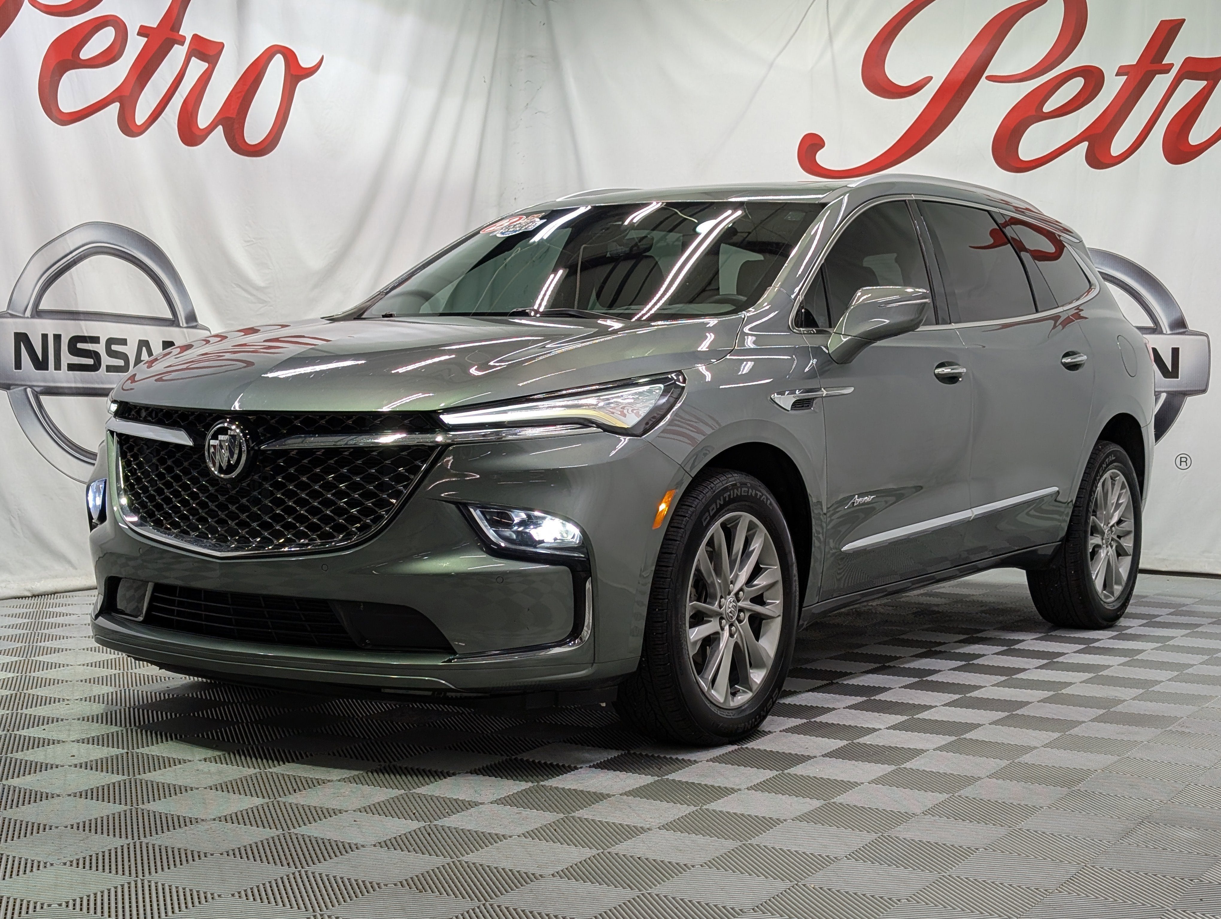 2023 Buick Enclave Avenir in Sage Metallic — front three-quarter view