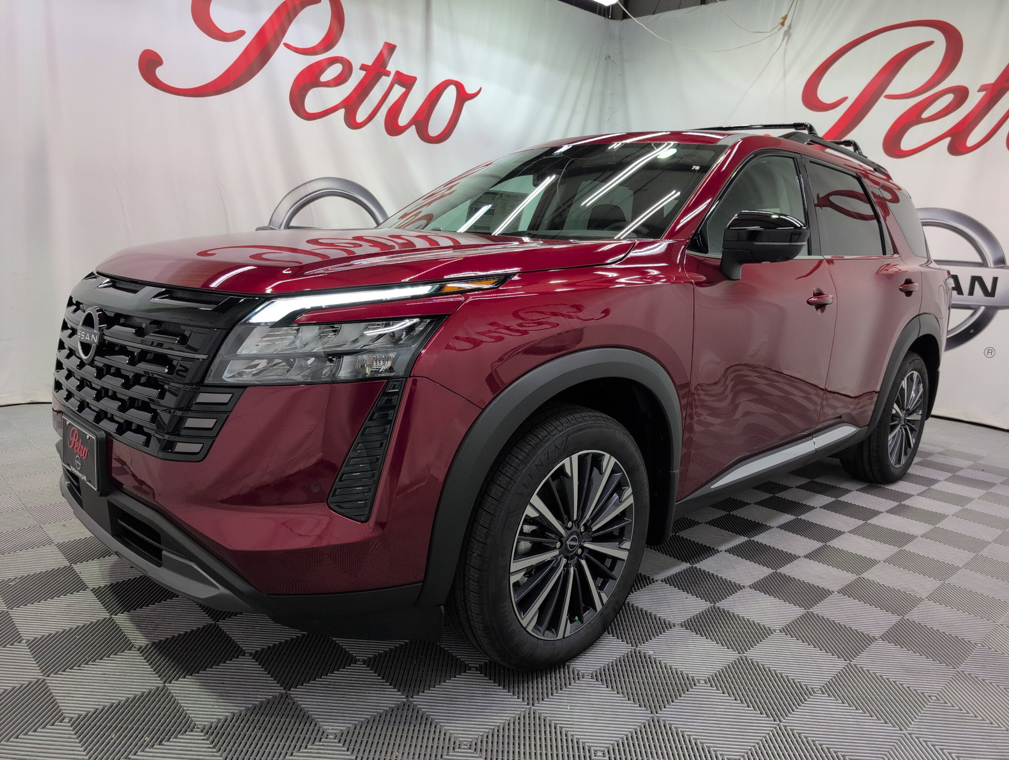 2026 Nissan Pathfinder Platinum in Scarlet Ember Tintcoat — front three-quarter view