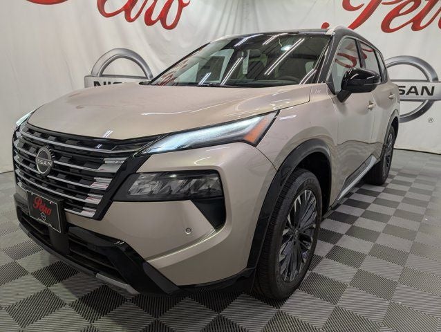 2026 Nissan Rogue Platinum in Champagne Silver Metallic — front three-quarter view