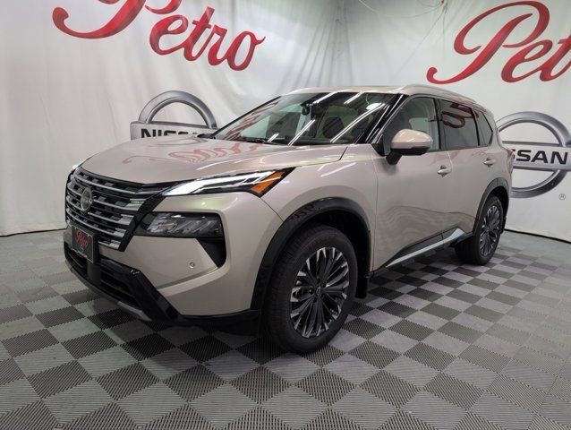 2026 Nissan Rogue Platinum in Champagne Silver Metallic — front three-quarter view