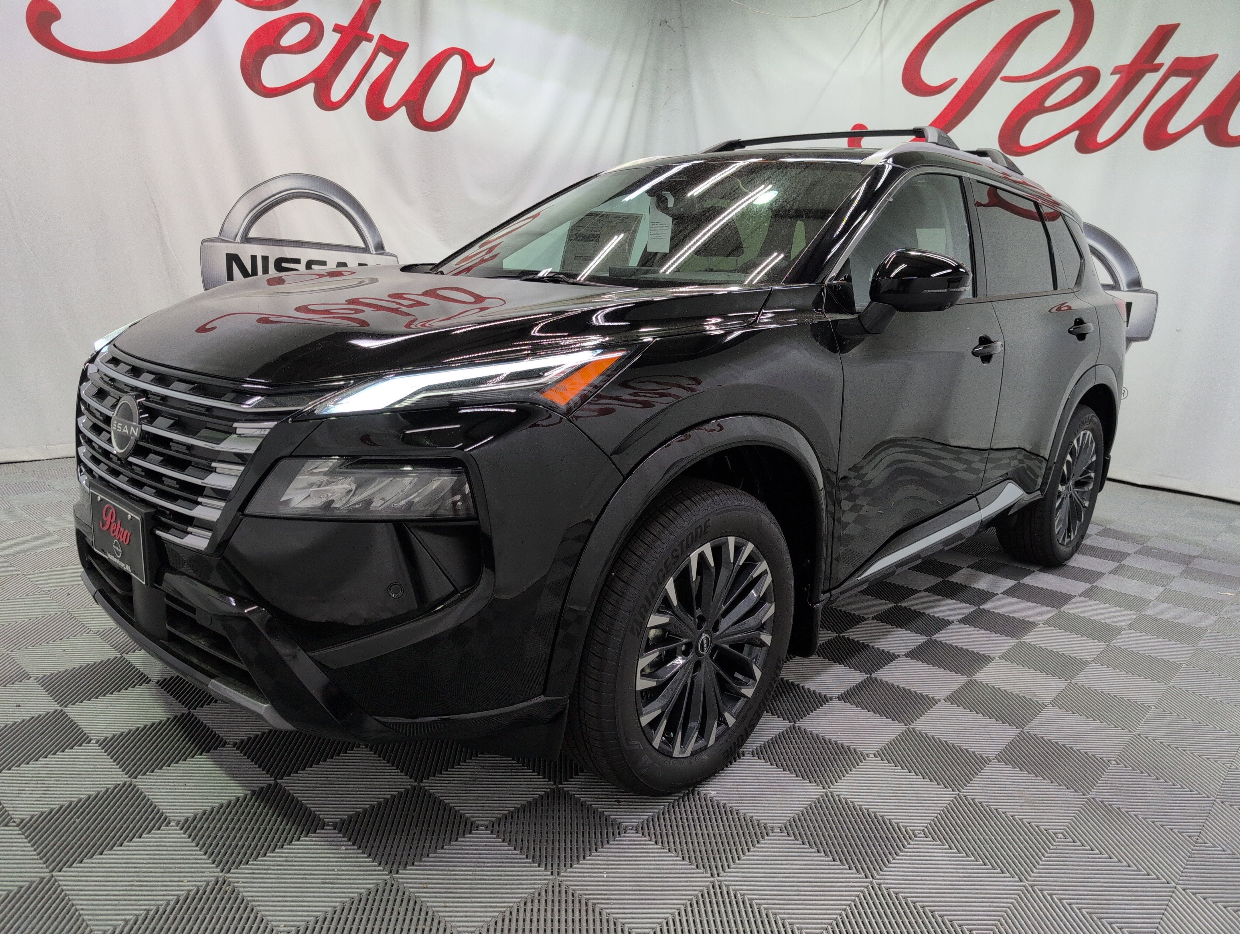 2026 Nissan Rogue Platinum in Super Black — front three-quarter view